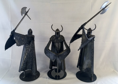 Group of 3 large steel helmeted warriors by sculptor Ron Lyon.