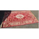 Large red ground Persian style rug