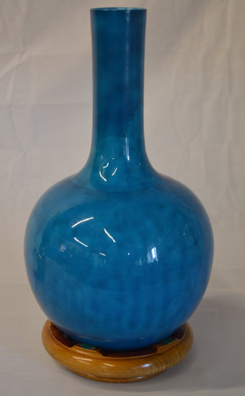 ** AMENDED DESCRIPTION ** Glazed ceramic vase on stand with previous restoration to neck