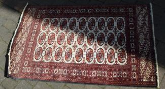 Red ground Persian rug 150cm x 92cm