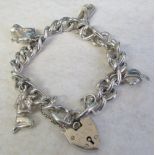 Silver charm bracelet with white metal charms total weight 1.