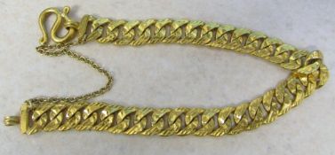 Tested as a minimum of 18ct gold Asian curb bracelet with safety chain weight 31.5 g L 7.