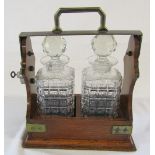 Tantalus with two glass decanters