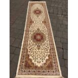 Ivory ground cashmere runner with medallion design 310cm by 78cm