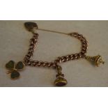 9ct gold charm bracelet with various 9ct gold charms,