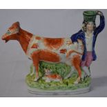 Staffordshire flatback spill vase of a gentleman & a cow