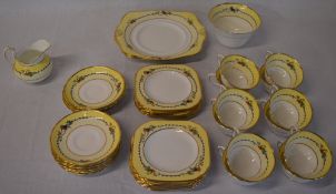 Art Deco style Tuscan china part tea service decorated in yellow with flowers and birds,