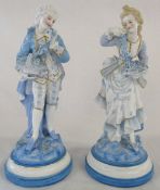 Pair of continental porcelain possibly French blue and white figurines of a lady and gentleman each