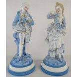 Pair of continental porcelain possibly French blue and white figurines of a lady and gentleman each