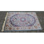 Cashmere duck egg blue ground rug with a floral medallion design