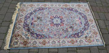 Cashmere duck egg blue ground rug with a floral medallion design