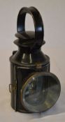 LMS black railway hand lamp, with small brass plate marked 'L.M.