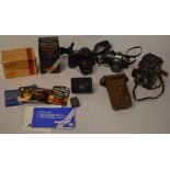 Vintage cameras and lenses including a Yashica C, Olympus OM-10,