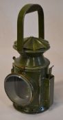 A Wakefield's of Birmingham guards railway hand lamp in dark green, with faded plaque to side,