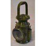 A Wakefield's of Birmingham guards railway hand lamp in dark green, with faded plaque to side,