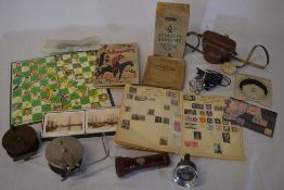 2 fishing reels, cigarette cards, snakes & ladders board, microscope, vintage fuel gauge, camera,