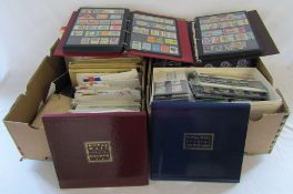 2 large boxes containing 2 albums of stamps,