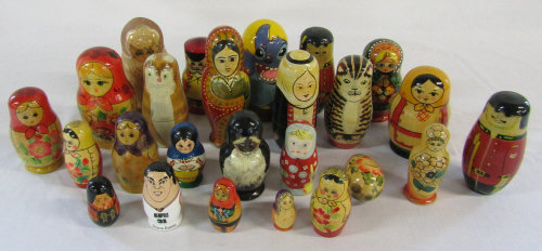 Collection of wooden Russian dolls and other stacking dolls and animals