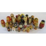 Collection of wooden Russian dolls and other stacking dolls and animals