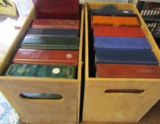 2 boxes containing 12 empty cigarette card albums with sleeves