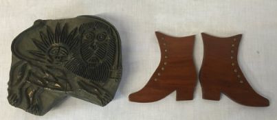 Wood cut printing block of a lion with the sun on its back & a pair of treen boots