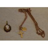 Small 9ct gold cameo pendant and a yellow metal religious necklace marked 10K,