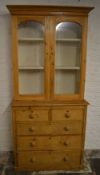Pine display bookcase on chest of drawers