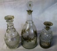 3 19th century glass decanters one with enamel floral swag decoration