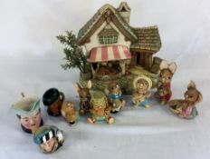 Pendelfin cottage with 7 figures (some with damage) & 3 miniature character jugs including Royal