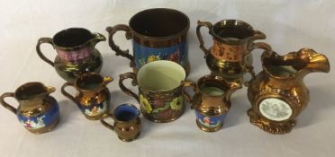 7 Victorian Sunderland lustre jugs & 2 tankards (one with repaired handle)