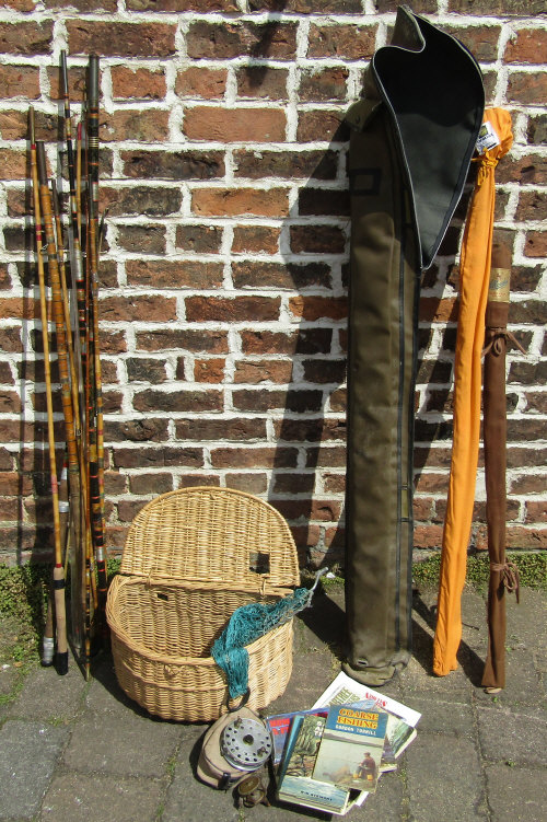 Fishing basket, fishing reels and books,