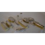 Various silver topped dressing table items, including hairbrushes,
