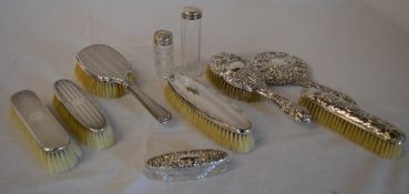 Various silver topped dressing table items, including hairbrushes,