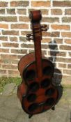 Wine rack in the form of a cello