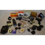 Various vintage cameras and accessories including Asahi Pentax, Praktica PLC3, various filters,