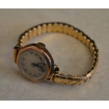 1920s/1930s 9ct gold body wristwatch on a rolled gold excalibur strap