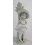 Lladro figure of a Mexican boy stood next to cactus