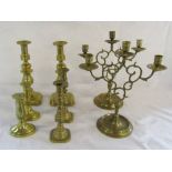 Selection of brass candlesticks and candelabras