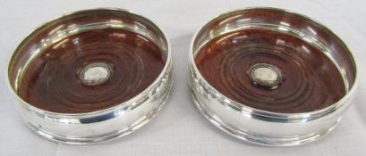 Pair of silver wine coasters with wooden bases London 1998 D 12.