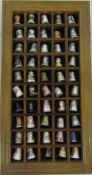 Wooden wall display containing 50 ceramic thimbles inc Royal Worcester,