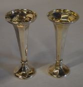 Pair of weighted silver candlesticks