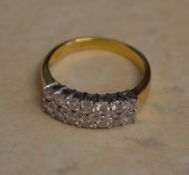 18ct gold dual row diamond ring with central diamond accent stones, approx 1ct of diamonds total,