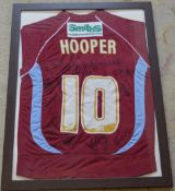 Framed Scunthorpe United signed football shirt,