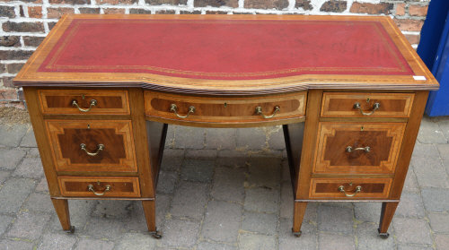 Inlaid Edwardian desk on twin pedestals with skiver top & bow front