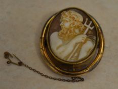 Yellow metal cameo brooch with safety chain,