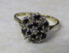 9ct gold illusion set diamond and sapphire cluster ring size O weight 2.