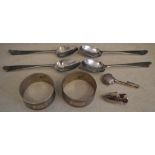 4 silver spoons, pair of silver napkin rings and 2 silver trinkets, total approx weight 3.