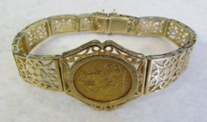 9ct gold ornate pierced bracelet set with a mounted 22ct gold Edward VII 1906 full sovereign with