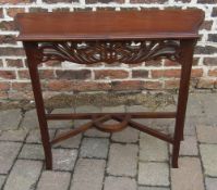 Small side table with fretwork panel