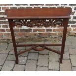 Small side table with fretwork panel